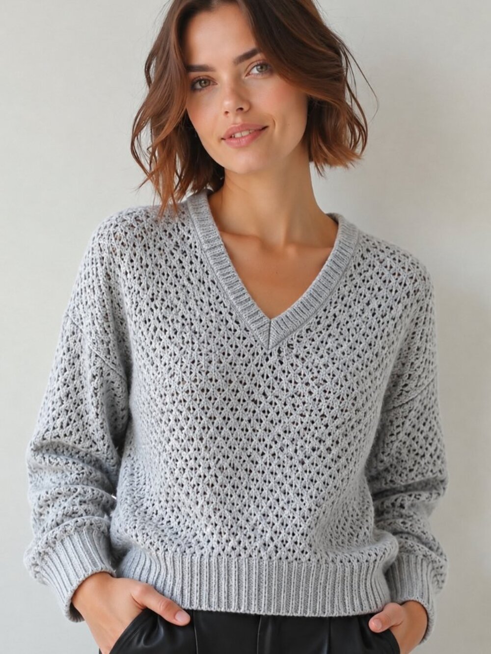 Open knit bluish grey v-neck sweater
